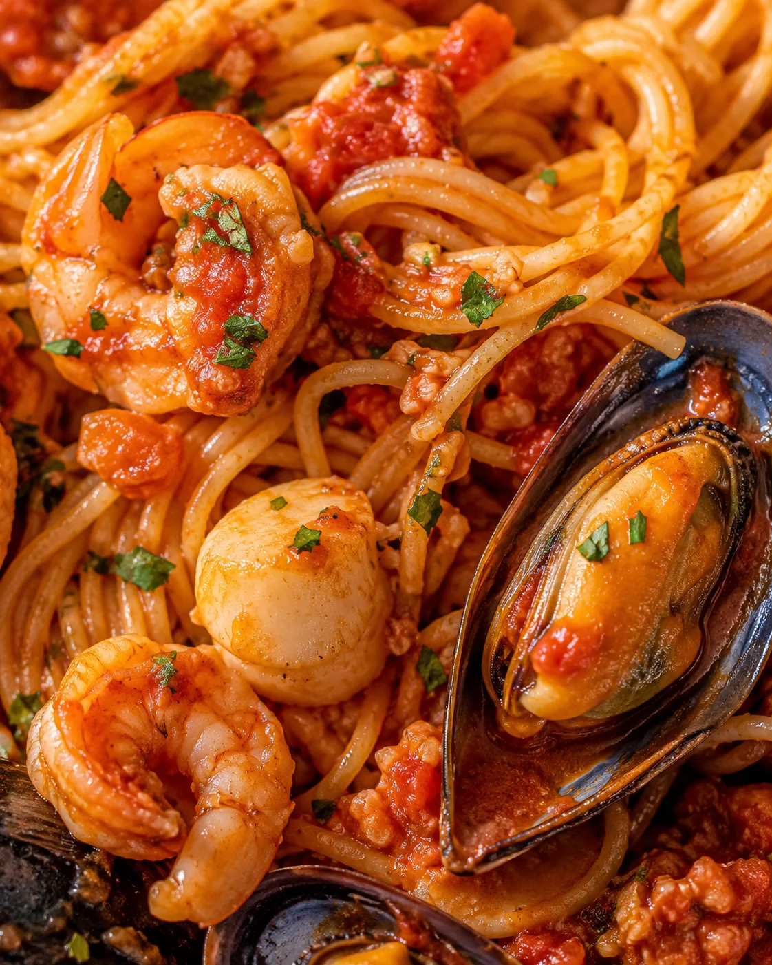 Seafood Pasta Delight Close-up of delicious seafood pasta with shrimp, scallops, and mussels in tomato sauce