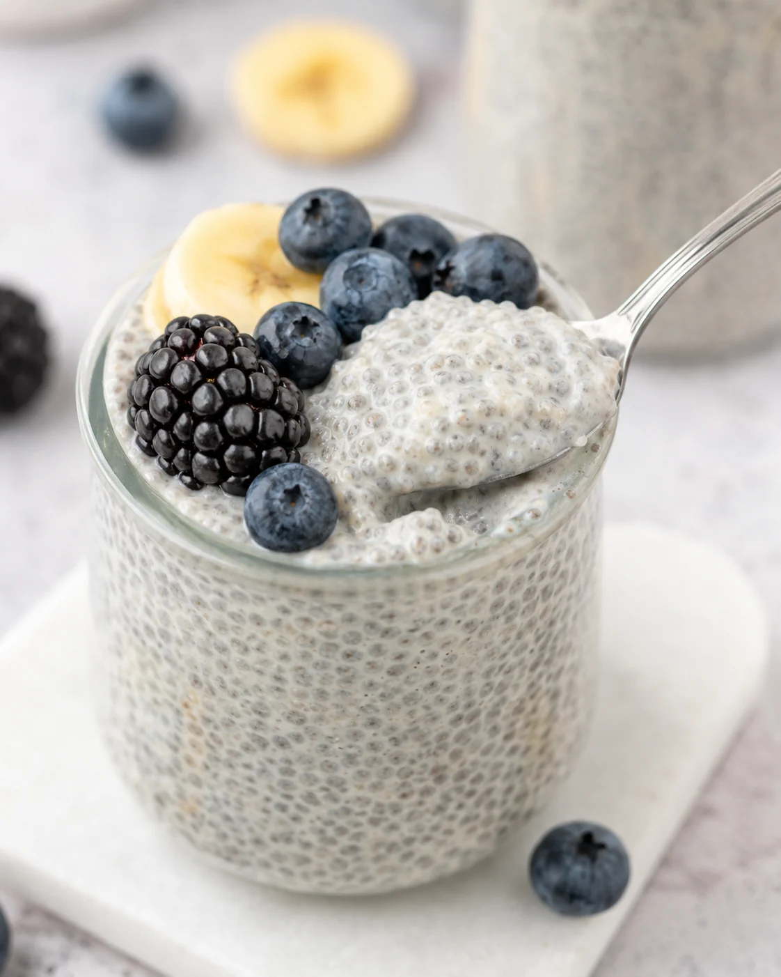 Creamy vanilla chia pudding topped with fresh blueberries and blackberries.