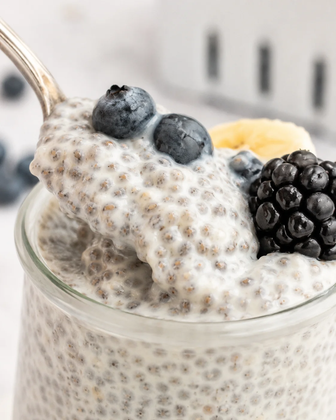 Creamy vanilla chia pudding topped with blueberries and blackberries.