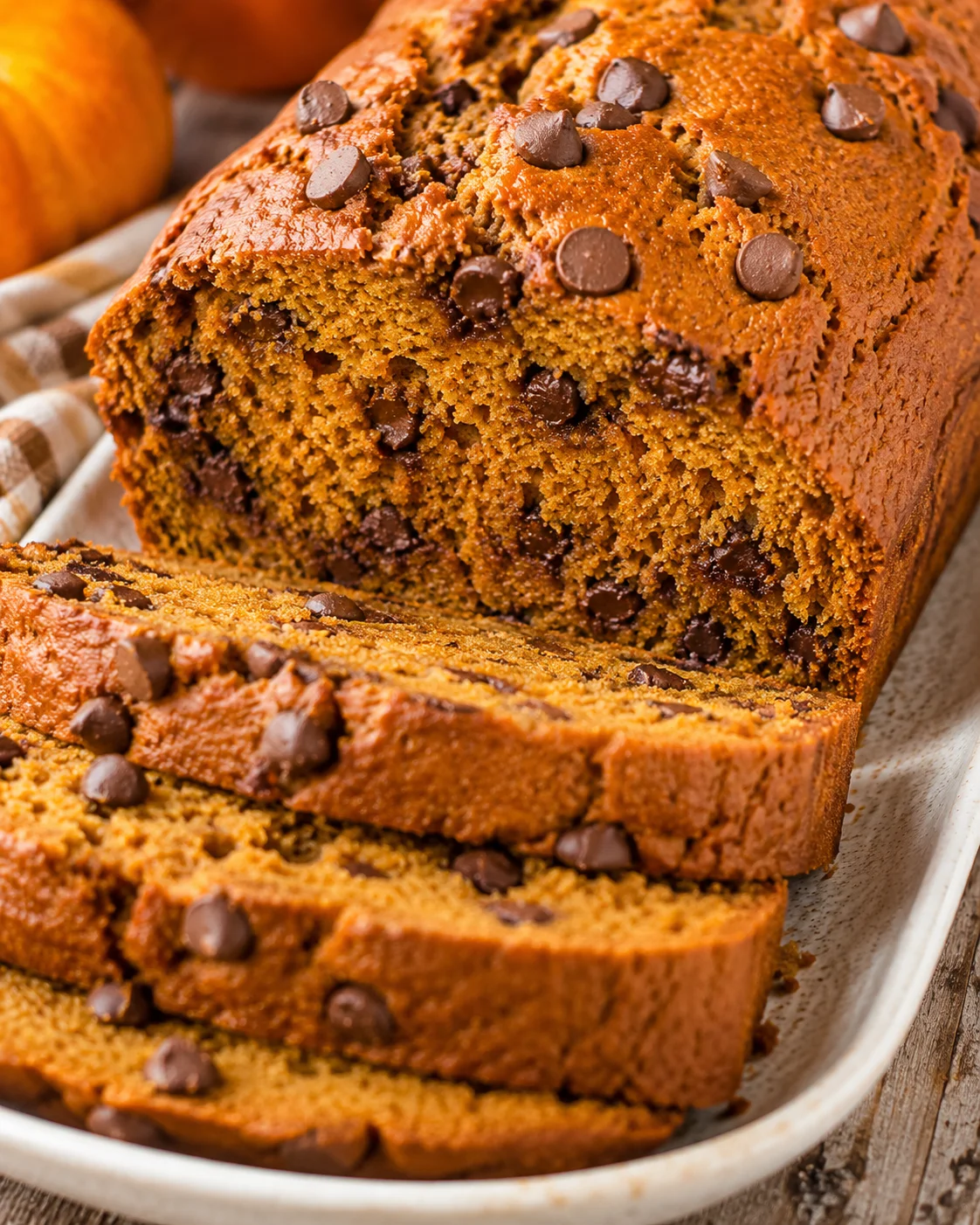 Sliced pumpkin chocolate chip bread on a platter